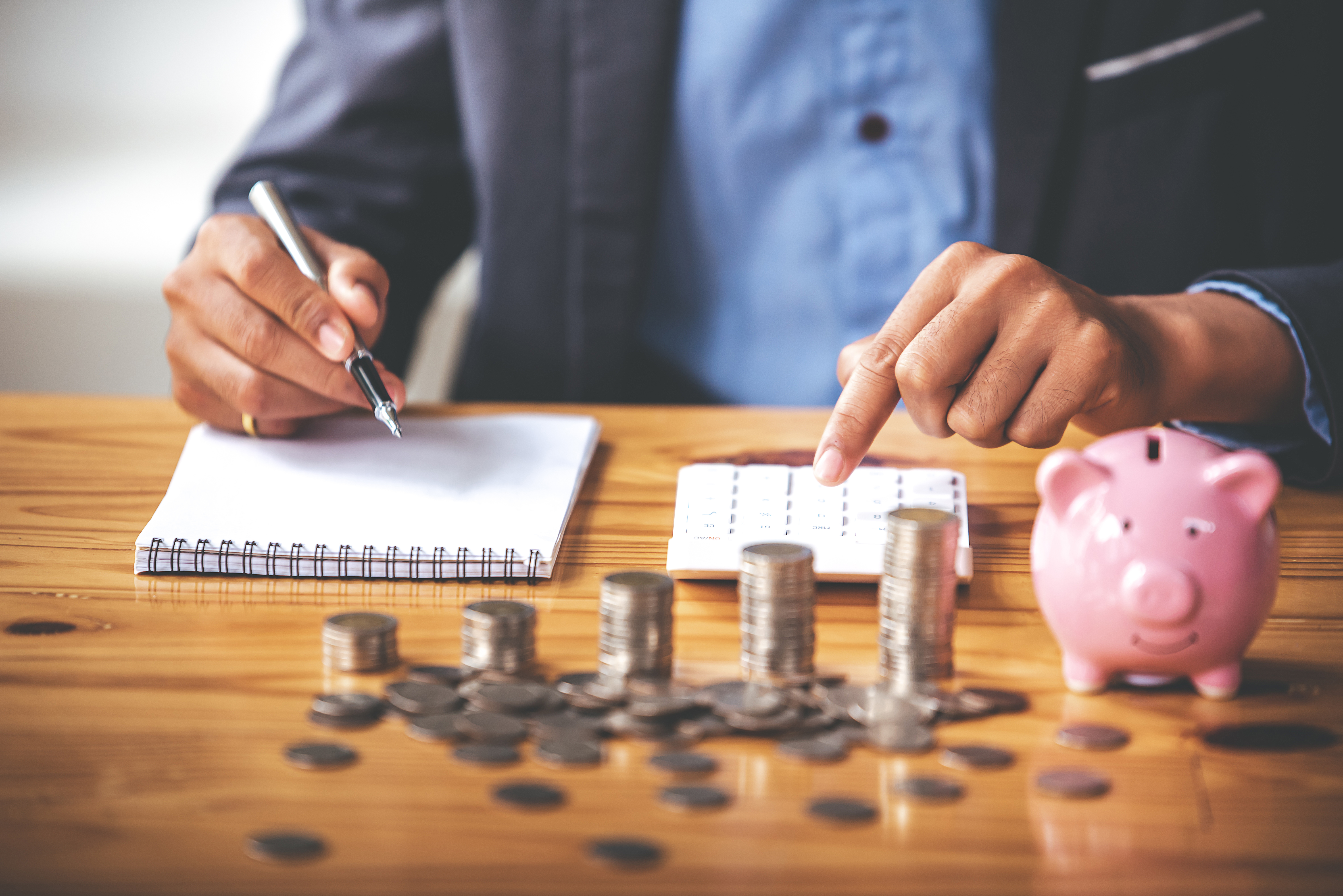 Professional reviewing financial documents and risk protection charts representing financial protection planning advice for income security and long-term financial planning.