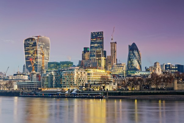 The London skyline and financial district representing retirement planning and decisions about how to combine pensions.